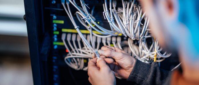 Setting network up, close-up. Connection procedure. Checking ethernet jack.